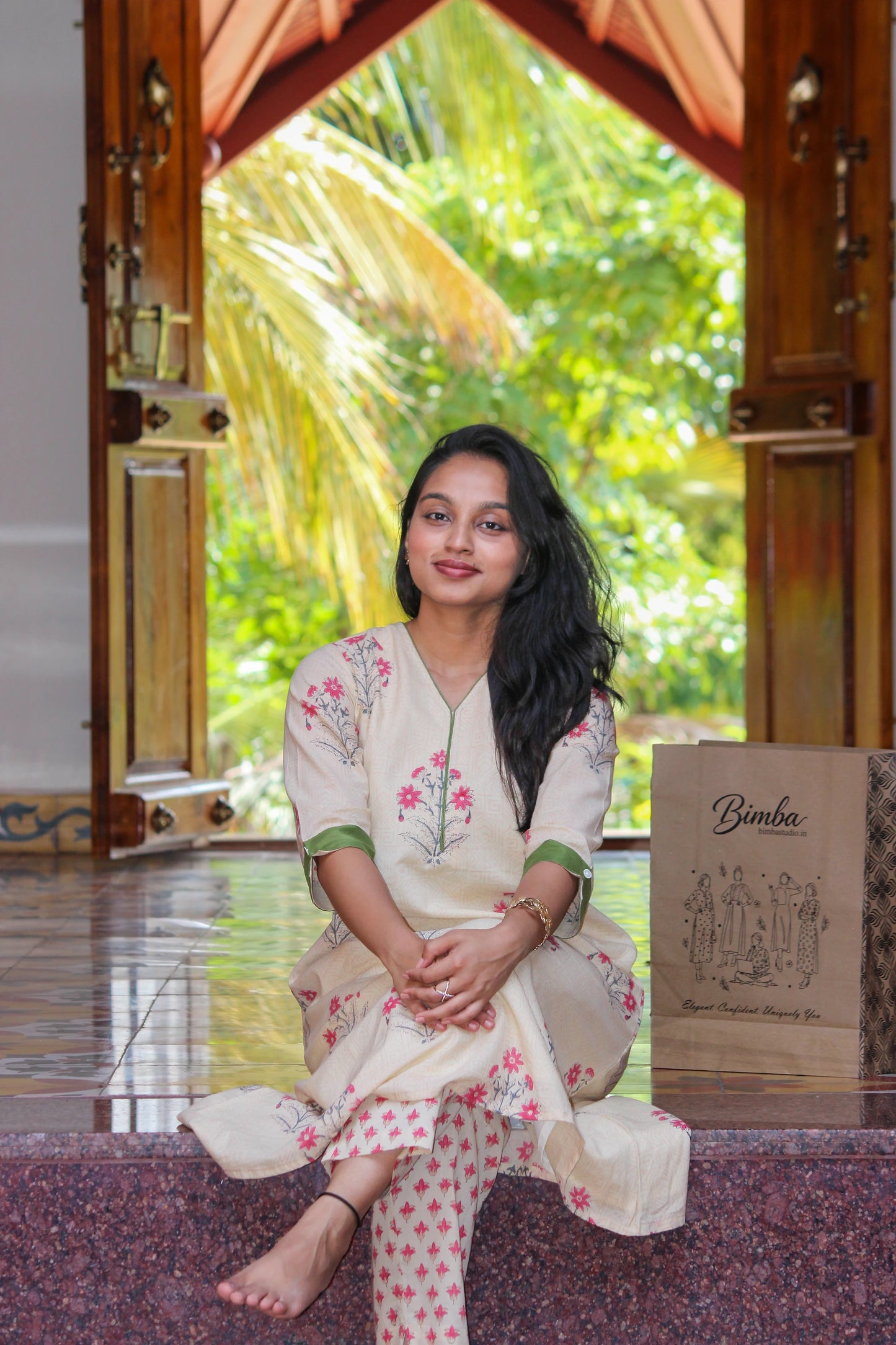 Aralu handblock printed cotton co-ord set for women by Bimba Studio featuring a floral print, V-neck kurta, and matching straight-fit pants.