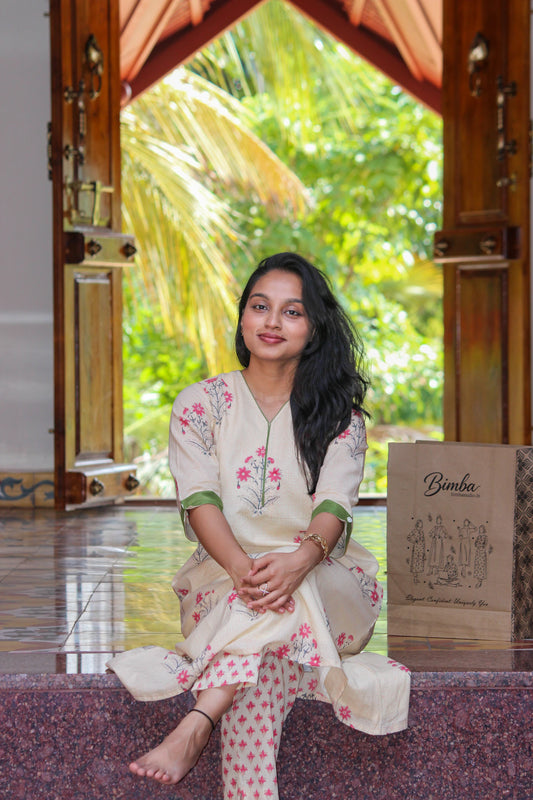 Aralu handblock printed cotton co-ord set for women by Bimba Studio featuring a floral print, V-neck kurta, and matching straight-fit pants.