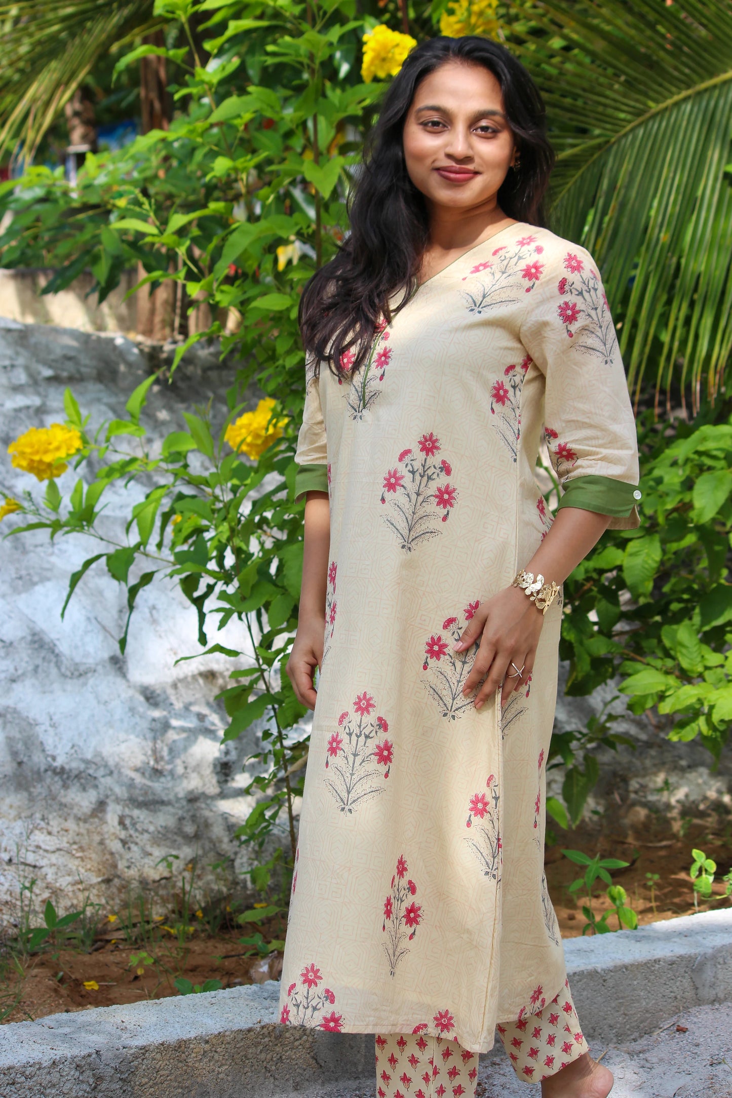 Floral handblock printed cotton co-ord set for women with a V-neck kurta and matching straight-fit pants.