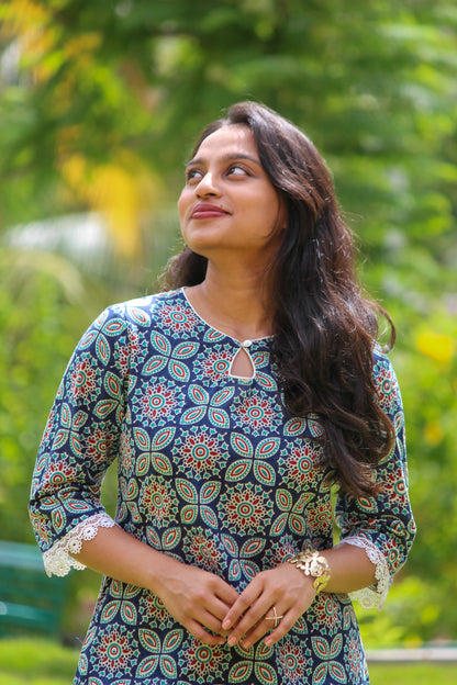 Geometric handblock printed cotton co-ord set for women with a V-neck kurta and matching straight-fit pants.