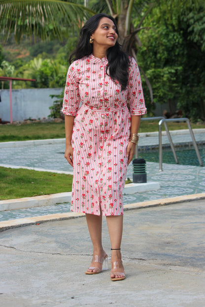 Bimba Studio Rose breathable cotton shirt dress featuring a floral print, functional pockets, and waist tie