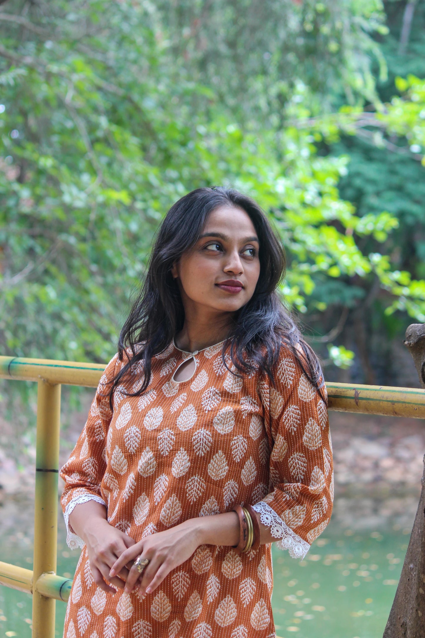 Tamra handblock printed cotton straight kurta for women by Bimba Studio featuring a botanical print, round neckline, and 3/4 sleeves.