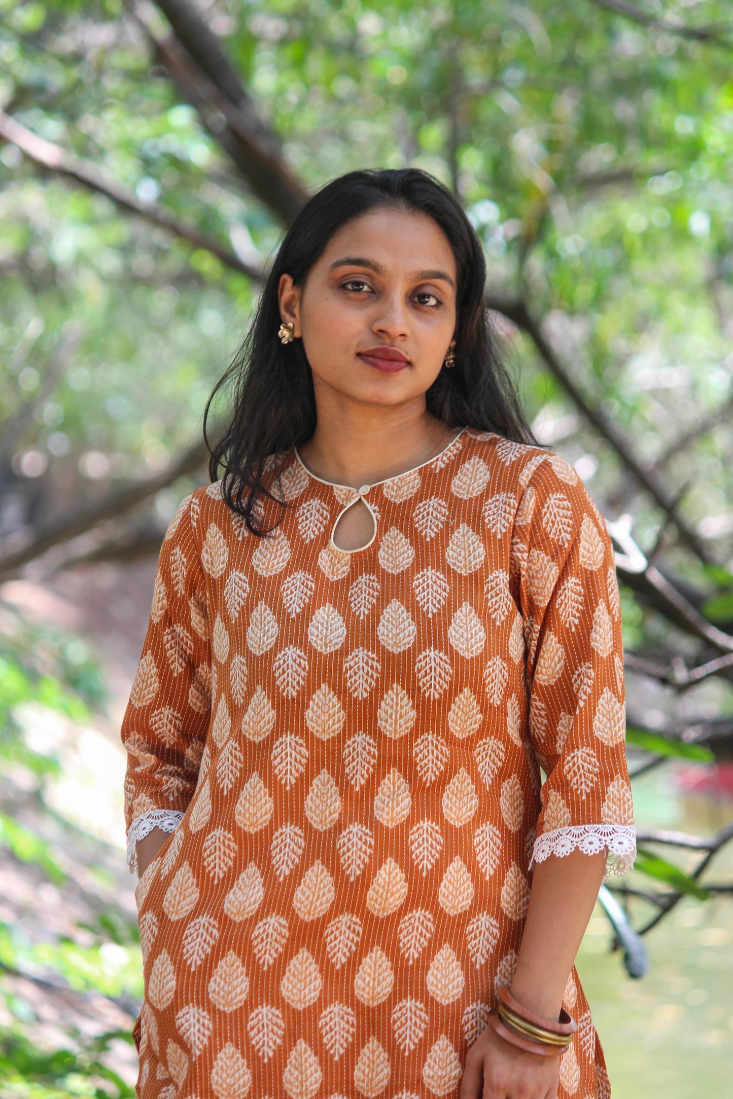 Bimba Studio Tamra breathable cotton straight kurta featuring a botanical handblock print and functional side pocket.