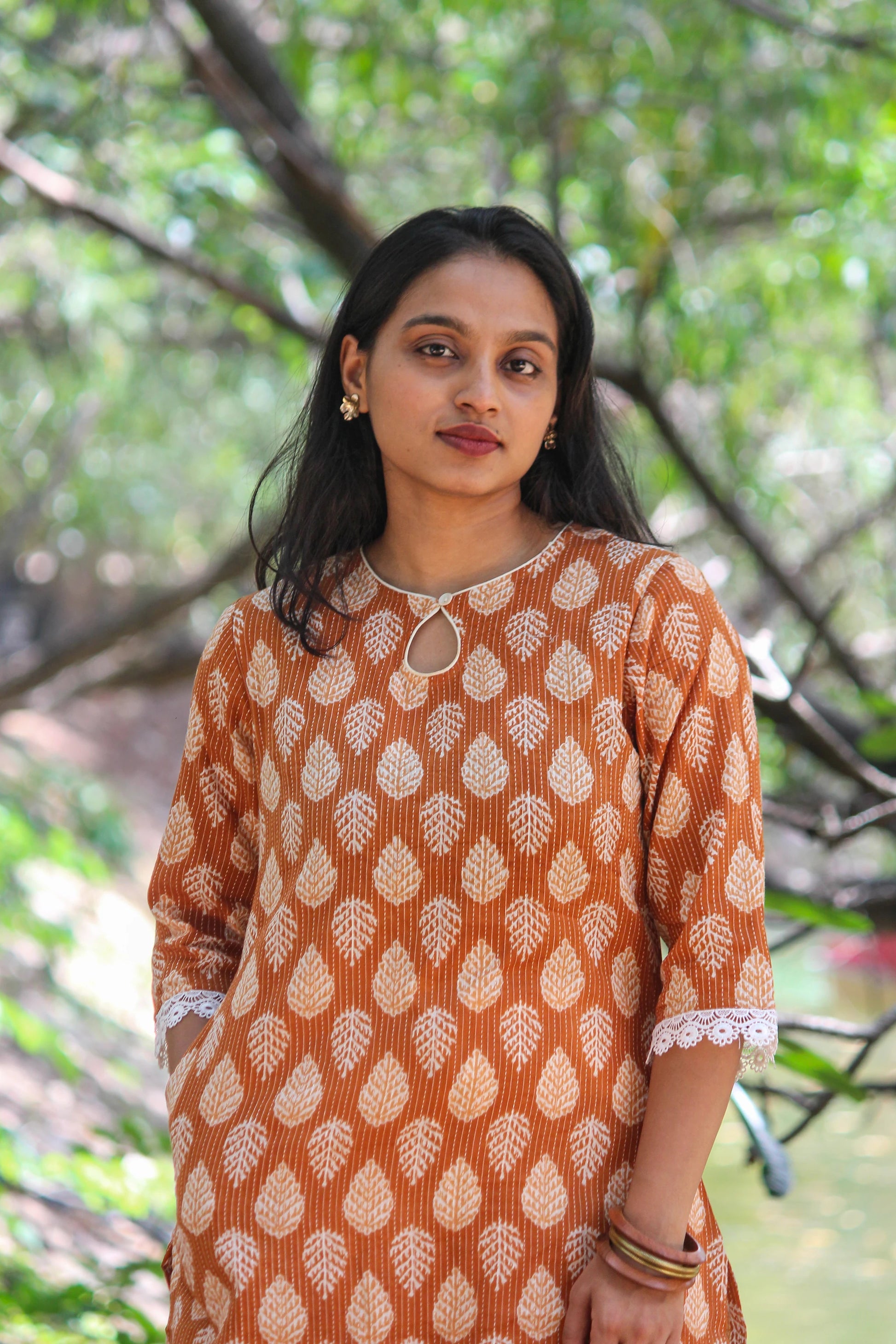 Bimba Studio Tamra breathable cotton straight kurta featuring a botanical handblock print and functional side pocket.