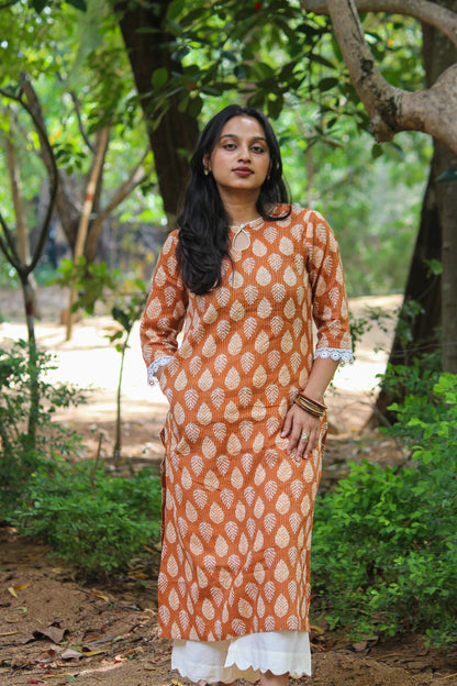 Bimba Studio Tamra breathable cotton straight kurta featuring a botanical handblock print and functional side pocket.