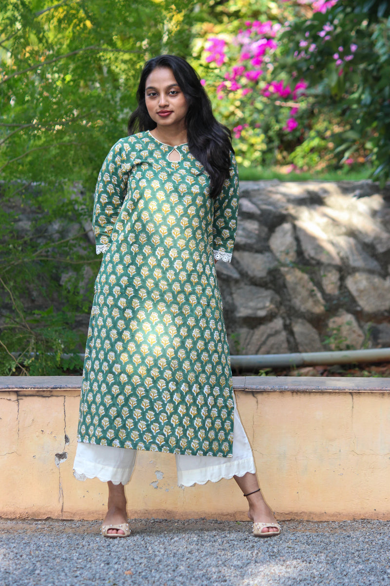 Veni handblock printed cotton straight kurta for women by Bimba Studio featuring a floral print, round neckline, and 3/4 sleeves.