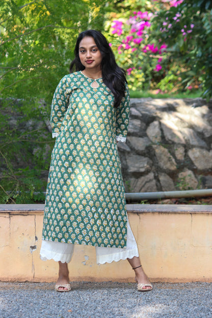 Veni handblock printed cotton straight kurta for women by Bimba Studio featuring a floral print, round neckline, and 3/4 sleeves.